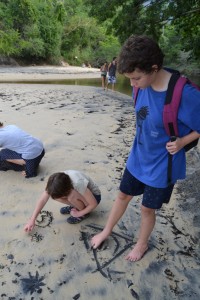Marike, Sophia and Karin J drawing in the sand