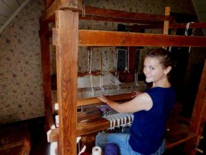 Me siting at an identical loom in the last house we visited.